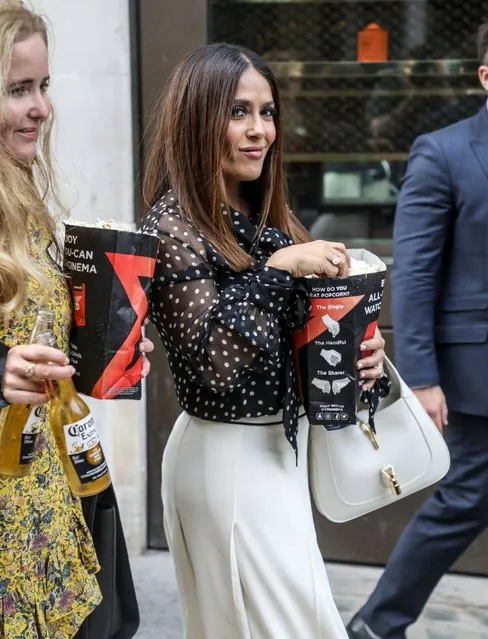 Mexican and American film actress Salma Hayek is seen eating popcorn as she leaves the premiere of The Hitman's Wife's Bodyguard in London, United Kingdom on June 14, 2021. (Photo by Backgrid USA)