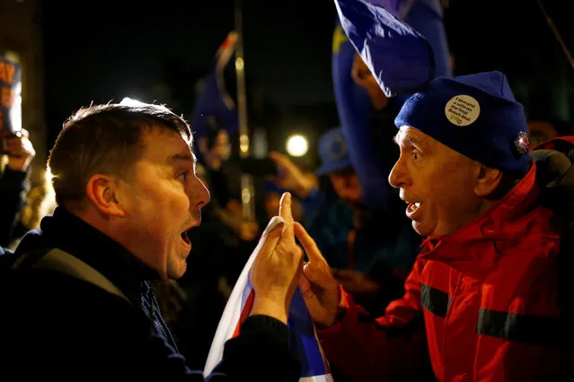 Pro-Brexit and anti-Brexit demonstrators argue with each other opposite the Houses of Parliament, in Westminster, central London, Britain December 11, 2018. (Photo by Henry Nicholls/Reuters)