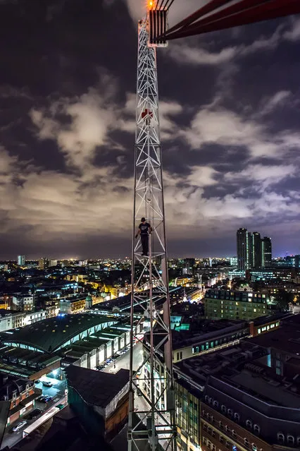Construction crane, City of London. An explorer scales a crane. (Photo by Luca Carenzo)