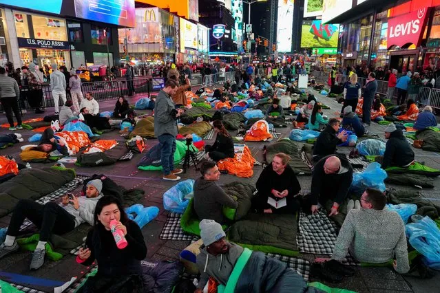 Activists attend a “sleep out” to raise awareness for youth homelessness, in Times Square, New York City, on November 16, 2023. (Photo by Reuters/Stringer)