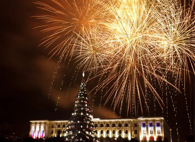 Fireworks go off over central Simferopol during New Year's Eve celebrations in Simferopol, Russia on December 31, 2018. (Photo by Sergei Malgavko\TASS via Getty Images)