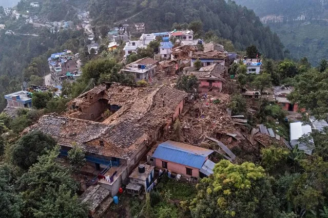 An aerial view shows collapsed houses in the aftermath of an earthquake in Chiuri village at Jajarkot district on November 5, 2023. At least 157 people were killed in isolated western districts of the Himalayan country when the 5.6-magnitude earthquake hit late November 3. (Photo by Prabin Ranabhat/AFP Photo)