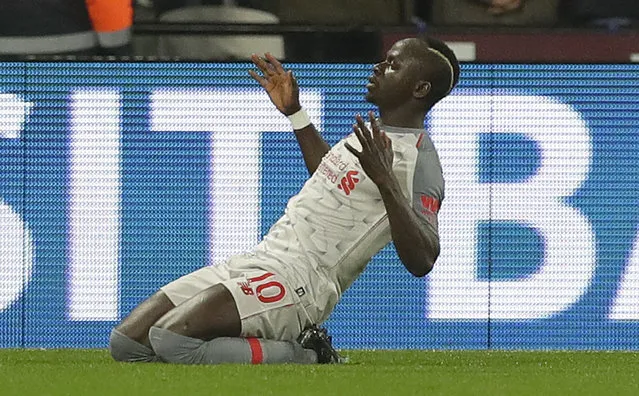 Liverpool's Sadio Mane celebrates after scoring his side's first goal during the English Premier League soccer match between West Ham United and Liverpool at the London Stadium in London, Monday, February 4, 2019. (Photo by Kirsty Wigglesworth/AP Photo)