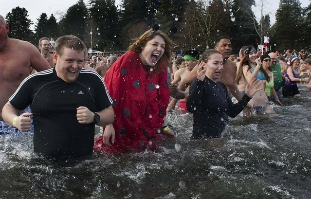 Participants react after entering Lake Washington during the Polar Bear Plunge in Seattle. (Photo by David Ryder/Reuters)