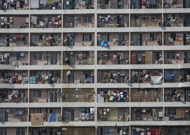 Windows of various apartments of a high-rise residential building are seen in the western suburb of Mumbai February 8, 2014. The cost for buying a 269 square feet (25 square meters) one-bedroom apartment in this building is around 9,293 Indian rupees ($ 150) per square feet or 2,500,000 Indian rupees ($ 40,000). The rent for an apartment in the same building is around 10,000 Indian rupees ($ 160) per month. (Photo by Danish Siddiqui/Reuters)