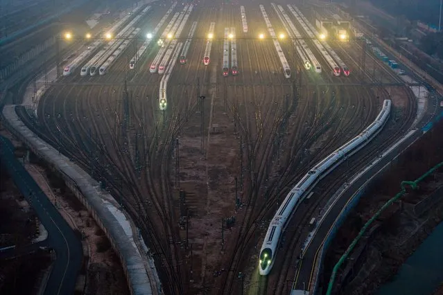 This aerial photo shows bullet trains leaving Nanjing south railway station in Nanjing, in eastern China's Jiangsu province on January 9, 2024. (Photo by AFP Photo/China Stringer Network)
