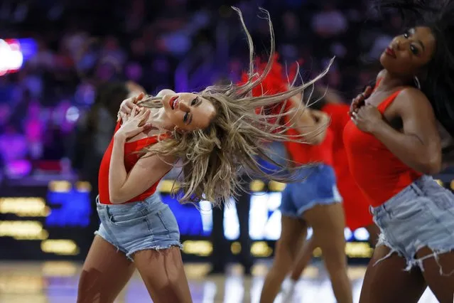 Members of the Washington Wizards Dancers dance during a timeout against the Utah Jazz in the second quarter at Capital One Arena in Washington, District of Columbia on January 25, 2024. (Photo by Geoff Burke/USA TODAY Sports)