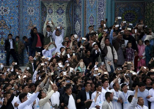 Afghans use their mobile phones to capture celebration of the Afghan New Year (Newroz) in Kabul, Afghanistan March 20, 2016. (Photo by Ahmad Masood/Reuters)