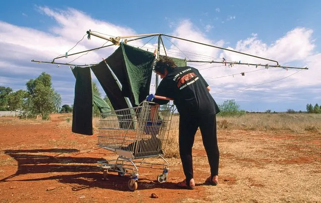 It is easy to love a sunburnt country on washing day. A man hangs his towels on the line at Leonora Motor Inn in the Leonora goldfields. (Photo by Frances Andrijich)