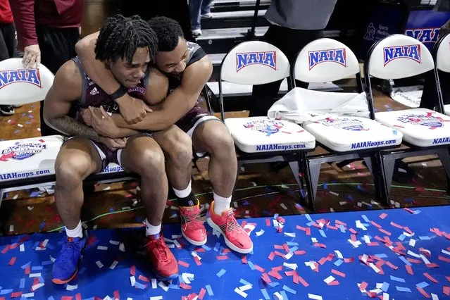 Freed-Hardeman guards Quan Lax, left, and JJ Wheat hug after their NAIA men's national championship college basketball game against Langston, Tuesday, March 26, 2024, in Kansas City, Mo. Freed-Hardeman won 71-67. (Photo by Charlie Riedel/AP Photo)