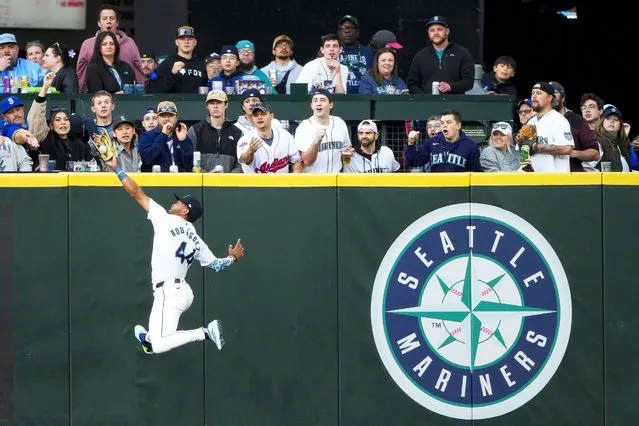 Seattle Mariners center fielder Julio Rodríguez makes a leaping catch on a fly ball hit by Cleveland Guardians' Will Brennan during the second inning of a baseball game Monday, April 1, 2024, in Seattle. (Photo by Lindsey Wasson/AP Photo)