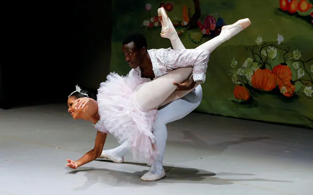 Oceane Deloge and Shamick Otieno of the Dance Centre Kenya (DCK) perform in the classic Christmas fairy tale, Tchaikovsky's ballet “The Nutcracker” to a live audience under coronavirus disease (COVID-19) safe guidelines at the Kenya National Theatre in Nairobi, Kenya on December 3, 2021. (Photo by Thomas Mukoya/Reuters)