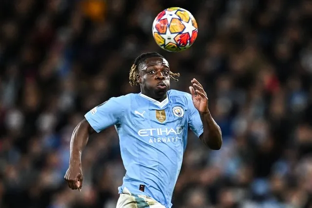Manchester City's Belgian midfielder #11 Jeremy Doku eyes the ball during the UEFA Champions League quarter-final second-leg football match between Manchester City and Real Madrid, at the Etihad Stadium, in Manchester, north-west England, on April 17, 2024. (Photo by Paul Ellis/AFP Photo)
