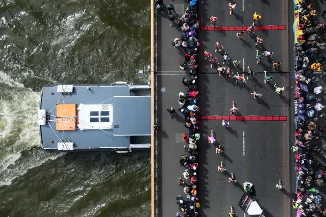 Runners cross Tower Bridge during the 2024 TCS London Marathon at on April 21, 2024 in London, England. The 2024 TCS London Marathon is the 43rd to be run over 26-miles around the capital, Competitive runners typically take between, two and a half to three and a half hours and recreational runners take between four and five hours to complete the distance. (Photo by Alishia Abodunde/Getty Images)