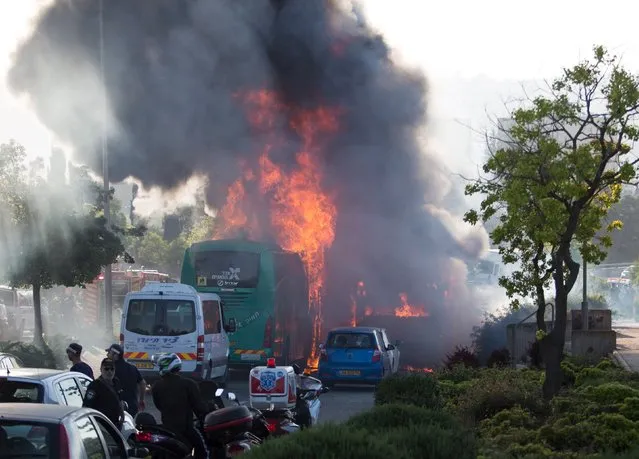 Flames rise at the scene where an explosion tore through a bus in Jerusalem on Monday setting a second bus on fire, in what an Israeli official said was a bombing, April 18, 2016. (Photo by Noam Revkin Fenton/Reuters)