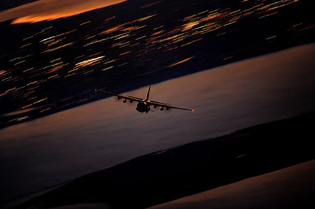 An AC-130U Gunship from the 4th Special Operations Squadron flies a local training mission on January 27, 2011 at Hurlburt Field, Fla. The AC-130U “Spooky” gunship is the primary weapon of Air Force Special Operations Command. Its primary missions are close air support, air interdiction and armed reconnaissance. The U model is an upgraded version of the H and is equipped with side firing, trainable 25mm, 40mm, and 105mm guns. (Photo by Air Force Master Sgt. Jeremy Lock/1st Combat Camera Squadron Deployed)