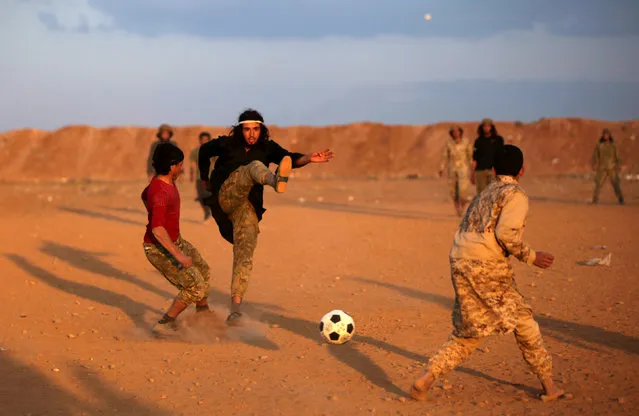 Free Syrian Army fighters play soccer in the northern Syrian town of al-Rai, Syria March 7, 2017. (Photo by Khalil Ashawi/Reuters)