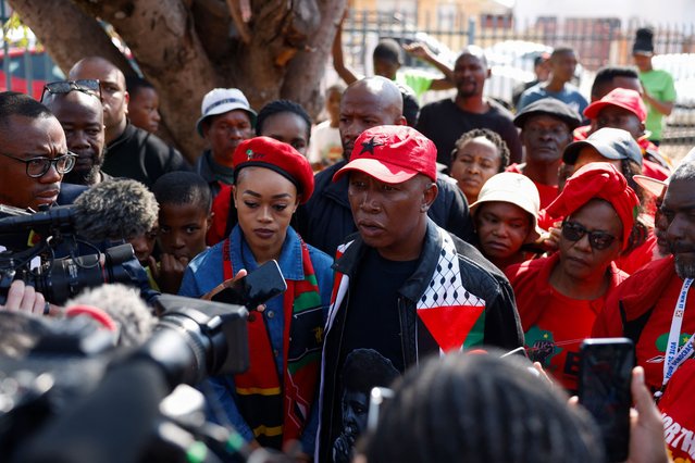 Economic Freedom Fighters (EFF) leader Julius Malema (C), wearing a scarf with the Palestinian flag on, speaks to the media as he arrives to vote at the Mponegele Primary School polling station in Seshego, Polokwane, on May 29, 2024, during South Africa's general election. South Africans vote on May 29, 2024 in what may be the most consequential election in decades, as dissatisfaction with the ruling ANC threatens to end its 30-year political dominance. (Photo by Paul Botes/AFP Photo)