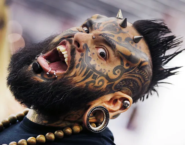 Emilio Gonzalez from Venezuela shows his tattoos and piercings on the first day of the Frankfurt Tattoo Convention in Frankfurt, Germany, Friday, April 21, 2017. (Photo by Michael Probst/AP Photo)
