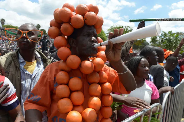 A supporter of veteran political leader and former prime minister Raila Odinga, attends a rally where Odinga was named as the presidential candidate for the National Super Alliance (NASA) party, during a rally in the capital Nairobi on April 27, 2017, ahead of the forthcoming elections in August. Kenya's five main opposition leaders hope their unprecedented alliance will be enough to defeat the ruling Jubilee Party on August 8. (Photo by Simon Maina/AFP Photo)