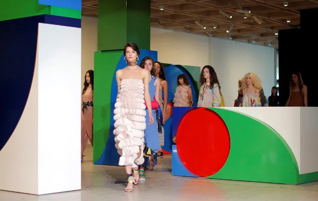 Models walk past geometric boxes during a runway show by Ginger and Smart at the Art Gallery of New South Wales at Fashion Week Australia in Sydney on May 17, 2017. (Photo by Jason Reed/Reuters)