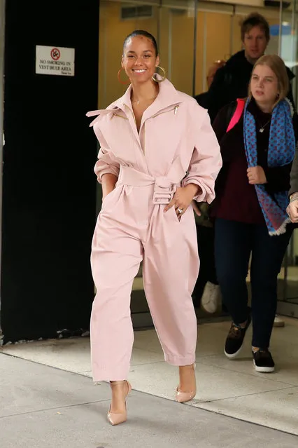 Singer Alicia Keyes is seen wearing a pink jumpsuit outside CBS Studios in New York City on November 20, 2019. (Photo by Christopher Peterson/Splash News and Pictures)