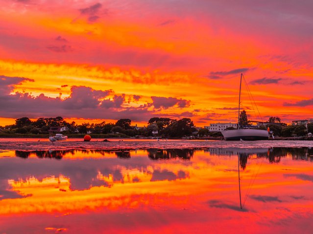 Sunset on Thursday evening, July 11, 2024 at Mudeford Quay in Dorset, UK at low tide. (Photo by Cenk Albayrak-Touye/Picture Exclusive)