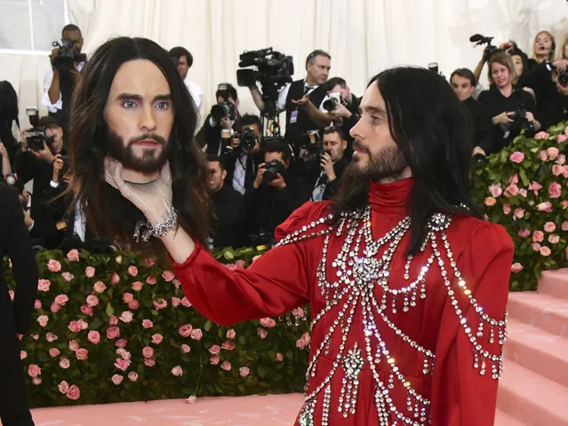 Jared Leto, holding a model of his own head, attends The Metropolitan Museum of Art's Costume Institute benefit gala celebrating the opening of the “Camp: Notes on Fashion” exhibition on Monday, May 6, 2019, in New York. (Photo by Charles Sykes/Invision/AP Photo)