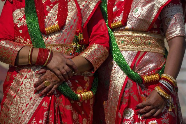 Nepalese women rest at the Pashupatinath temple during Teej festival celebrations in Kathmandu, Nepal, Friday, September 6, 2024. (Photo by Niranjan Shrestha/AP Photo)