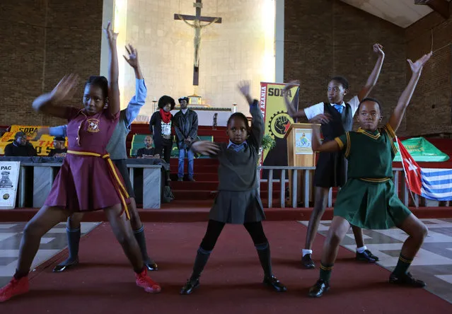 Schoolgirls perform a dance as they commemorate the 40th anniversary of the Soweto Uprising in the Regina Mundi Church in Soweto, Thursday, June 16 2016. South Africans marked the 40th anniversary of a pivotal moment in the anti-apartheid struggle, a 1976 black student uprising, that led to a deadly crackdown. (Photo by Denis Farrell/AP Photo)