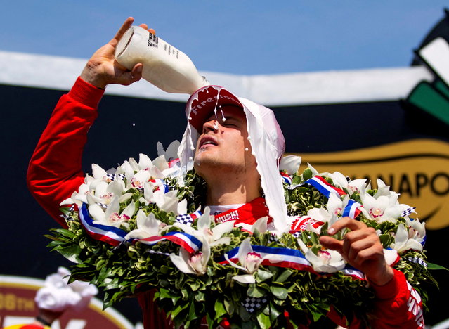 IndyCar Series driver Marcus Ericsson celebrates with the milk after winning the Indianapolis 500 at Indianapolis Motor Speedway in Indianapolis, Indiana on May 29, 2022. (Photo by Mark J. Rebilas/USA TODAY Sports)