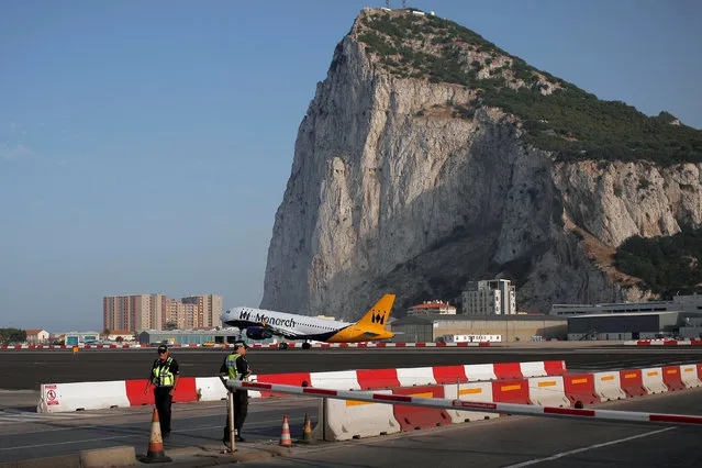 A Monarch aircraft takes off at the Gibraltar International Airport in front of the Rock in the British overseas territory of Gibraltar, historically claimed by Spain, June 24, 2016, after Britain voted to leave the European Union in the EU BREXIT referendum. (Photo by Jon Nazca/Reuters)