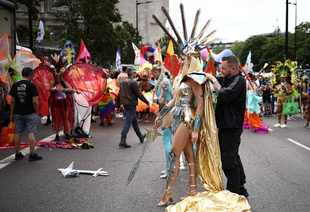 Members of the Lesbian, Gay, Bisexual and Transgender (LGBT+) community prepare to take part in the annual Pride Parade in the streets of London on July 1, 2023. (Photo by Henry Nicholls/AFP Photo)