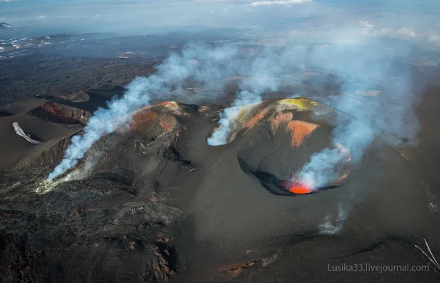 Take a look at this stunning photo of Tolbachik, an active volcanic complex on the Kamchatka Peninsula in far eastern Russia. Lava fountains and rivers ran through the area for months after the eruption began with the opening of two Tolbachik fissures in November of 2012. In the midst of this activity, photographers Luda and Andrey (lusika33) took a trip down to see that stunning hell valley on earth. (Photo by lusika33)