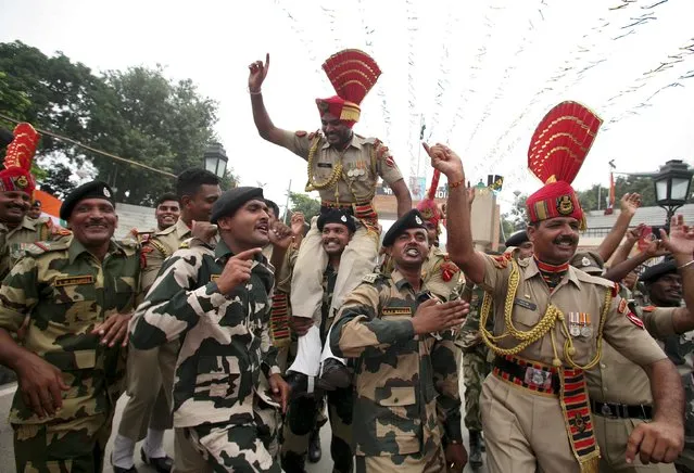 Indian Border Security Force (BSF) soldiers dance during India's Independence Day celebrations at the India-Pakistan joint check post at the Wagah border on the outskirts of Amritsar, India, August 15, 2015. (Photo by Munish Sharma/Reuters)