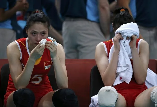 China's Ma Yunwen (L) and Hui Ruoqi react after losing their women's quarterfinal volleyball match against Japan at Earls Court during the London 2012 Olympic Games August 7, 2012. (Photo by Ivan Alvarado/Reuters)