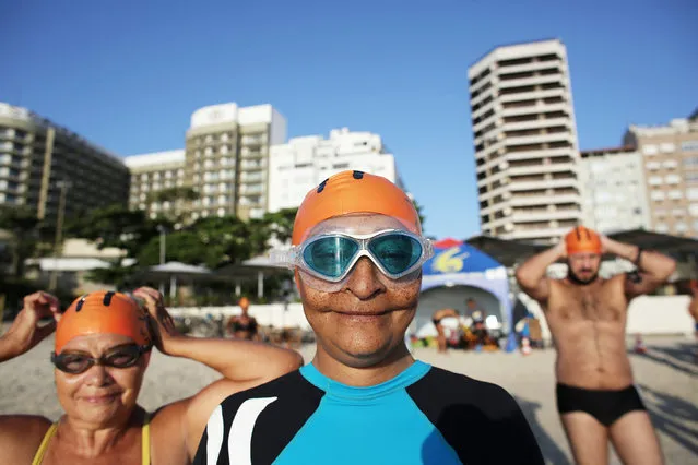 People prepare for a swimming course on Copacabana beach in Rio de Janeiro, Brazil, April 14, 2016. (Photo by Nacho Doce/Reuters)