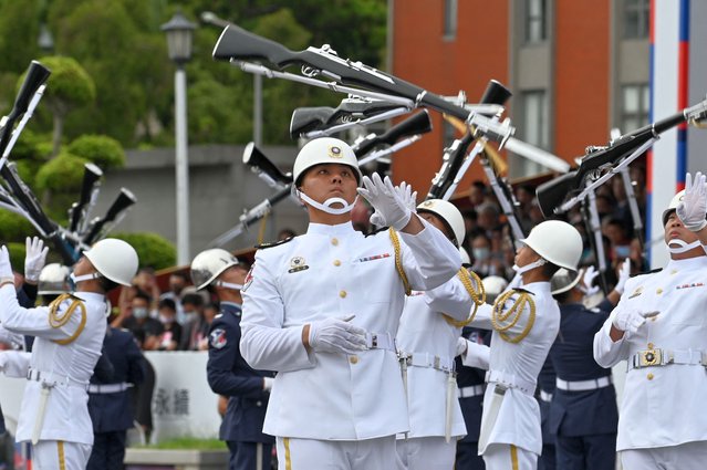 Honor guards perform during the national day in front of the Presidential Office in Taipei on October 10, 2023. (Photo by Sam Yeh/AFP Photo)