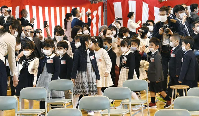 First-year pupils wearing face mask attend their entrance ceremony amid concern over the spread of coronavirus, at an elementary school in Sapporo, northern Japan, Monday, April 6, 2020. In Japan, reports say Prime Minister Shinzo Abe plans to declare an emergency in Tokyo and other cities Tuesday. (Photo by Kyodo News via AP Photo)