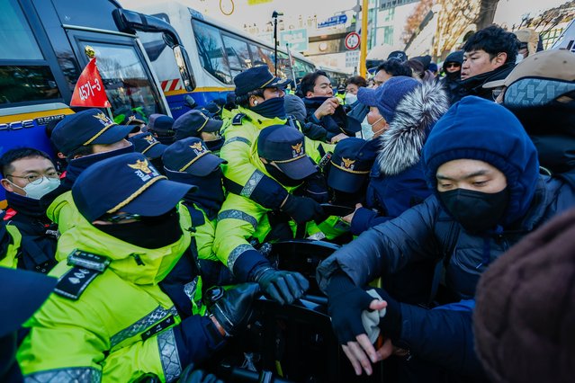 Supporters of Yoon Suk Yeol confront the police, as authorities make a second attempt to arrest the impeached South Korean president Yoon, in Seoul, South Korea, on January 15, 2025. The martial law political instability has been intensifying, creating polarization, and affecting the economy, as authorities face difficulties executing the second arrest warrant issued by a court against on Yoon, who has been holed up in his fortified presidential residence. (Photo by Daniel Ceng/Anadolu via Getty Images)