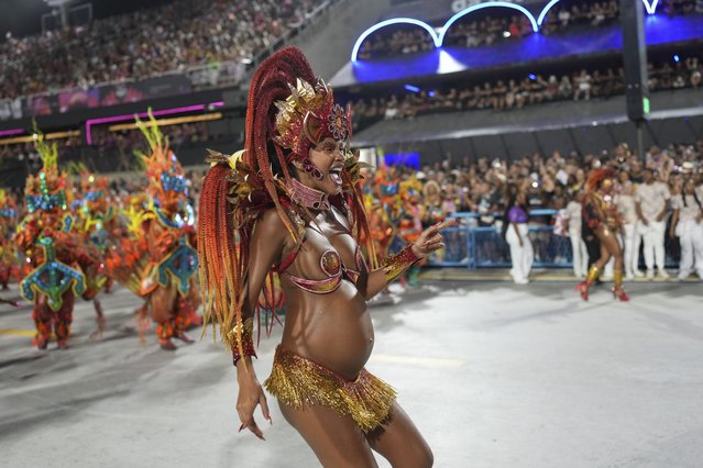 A pregnant woman from the Viradouro samba school parades during Carnival celebrations at the Sambadrome in Rio de Janeiro, Monday, March 3, 2025. (Photo by Silvia Izquierdo/AP Photo)
