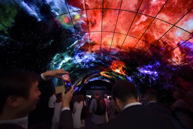 Visitors look at screens at the IFA Electronics show in Berlin, Germany September 2, 2016. (Photo by Stefanie Loos/Reuters)