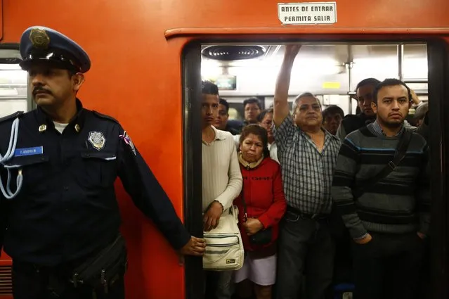 People stand inside a crowded passenger car of the subway in Mexico City October 24, 2014. (Photo by Enrique Castro-Mendivil/Reuters)