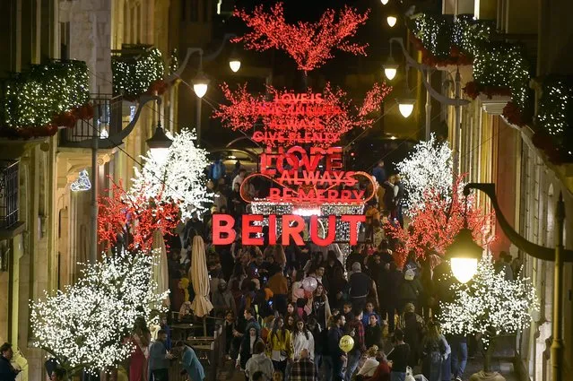 People view seasonal illuminations on display to celebrate the upcoming Christmas and the New Year holidays at Beirut Souks in downtown Beirut, Lebanon, 04 December 2022. Lebanon has been struggling with compounded crises for nearly two years, including the economic and financial crisis and the explosion at Beirut's port. The World Bank says the economic crisis in the country is possibly among top three most severe crisis episodes globally since the mid-nineteenth century. (Photo by Wael Hamzeh/EPA/EFE)