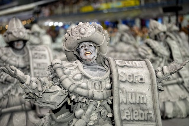 A dancer from the Mocidade Alegre samba school performs during a Carnival parade in Sao Paulo, Brazil, Sunday, February 11, 2024. (Photo by Andre Penner/AP Photo)