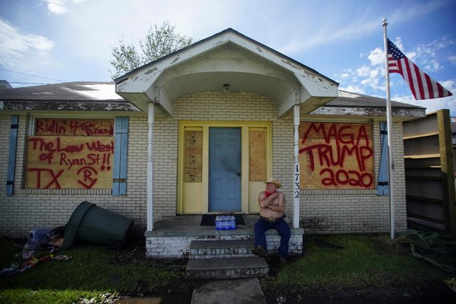 Donnie Rogers sits at the entrance to his house after Hurricane Laura passed through Lake Charles, Louisiana, U.S., August 27, 2020. (Photo by Elijah Nouvelage/Reuters)