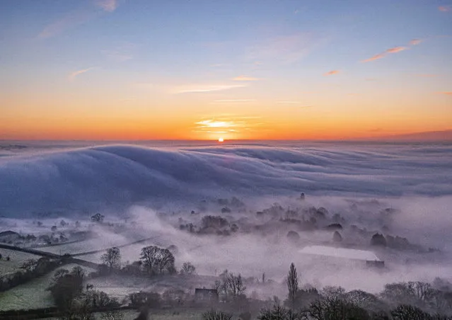 Mist rolls across Glastonbury in Somerset, England as Brits woke up to a frosty morning on Sunday, January 19, 2020. (Photo by South West News Service)