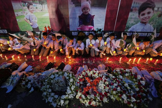 Students participate in a candle light vigil for children, who were killed in the Indian missile strikes, in Islamabad, Pakistan, Thursday, May 8, 2025. (Photo by Anjum Naveed/AP Photo)