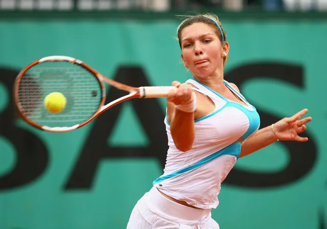 Simona Halep of Romania hits a forehand during the Girl's Singles Final match against Elena Bogdan of Romania on day fifteen of the French Open at Roland Garros on June 8, 2008 in Paris, France. (Photo by Julian Finney/Getty Images)