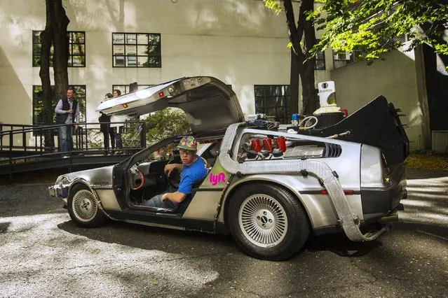 Dom Artale parks a DeLorean Motor Company DMC-12 customized to look identical to the car used in the film "Back to the Future Part II" and that will be part of a Lyft promotion in New York, October 21, 2015. (Photo by Lucas Jackson/Reuters)